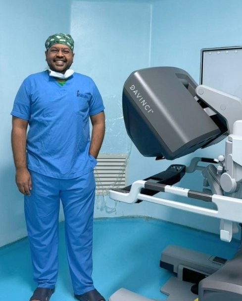 Dr Anuj Shah with Robot